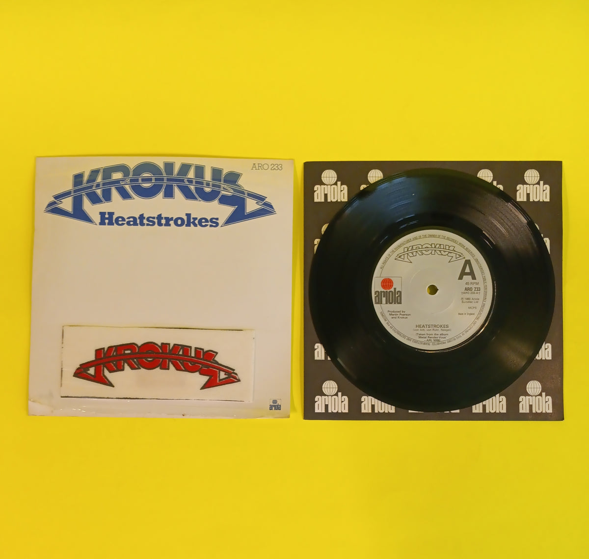Krokus - Heatstrokes / Shy Kid (UK 7" w. Patch) - 1980 - ARO 233 Used - VG++ - Vinyl Krokus - Heatstrokes / Shy Kid (UK 7" w. Patch) - 1980 - ARO 233 Used - VG++ - Vinyl