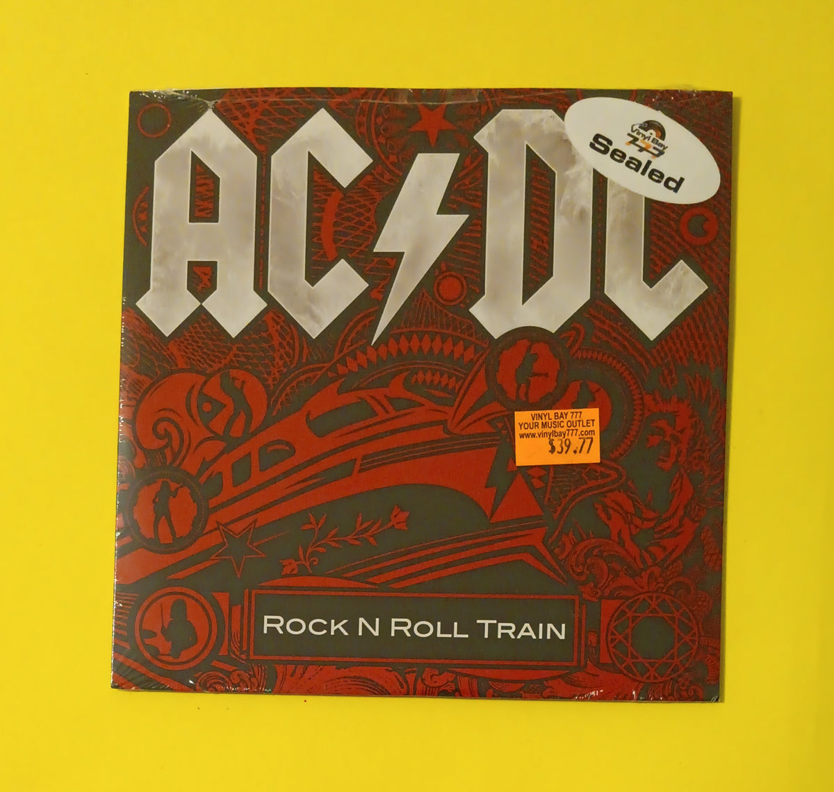 AC/DC - Rock N Roll Train / War Machine - 2008 - 88697 383617 New - Sealed - 7" Vinyl AC/DC - Rock N Roll Train / War Machine - 2008 - 88697 383617 New - Sealed - 7" Vinyl