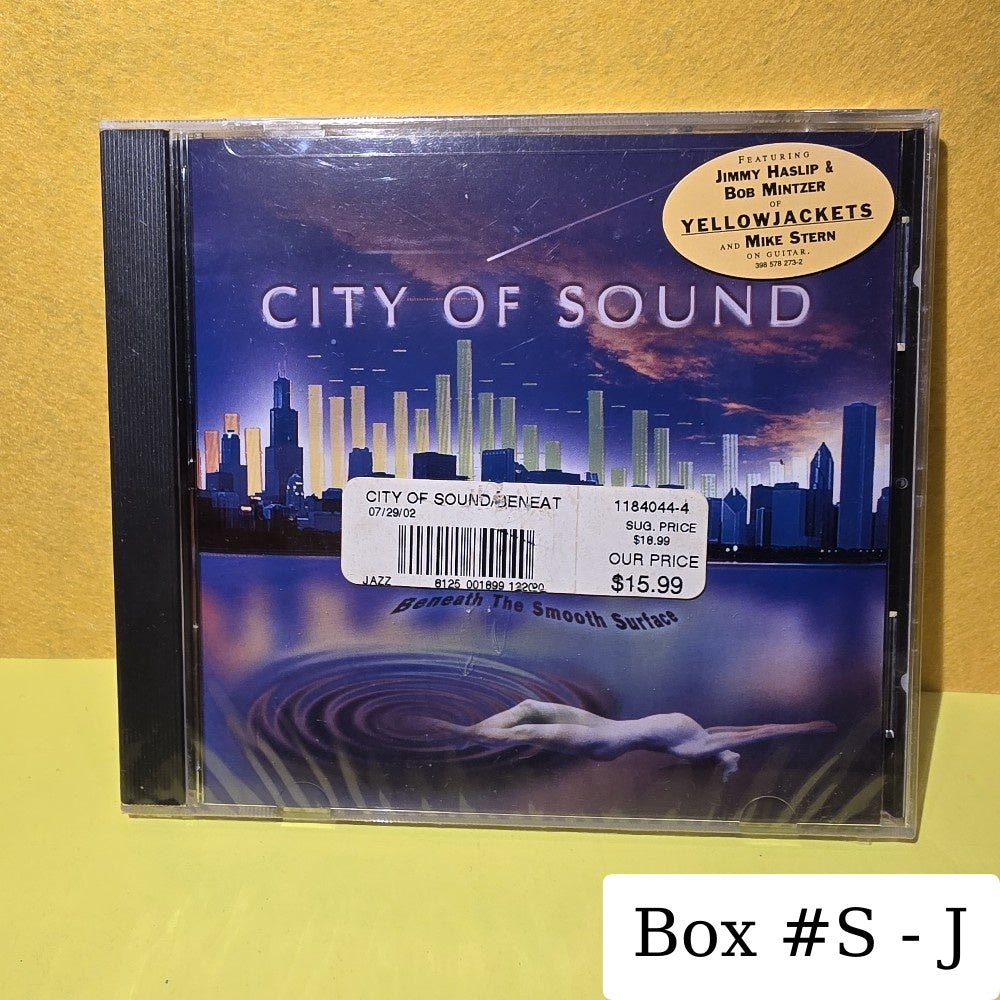 City Of Sound Featuring Mike Stern, Bob Mintzer, Jimmy Haslip, Dave Onderdonk, Mike Cunningham  - Beneath The Smooth Surface - 2002 - 398 578 273-2 - New - Sealed - CDs