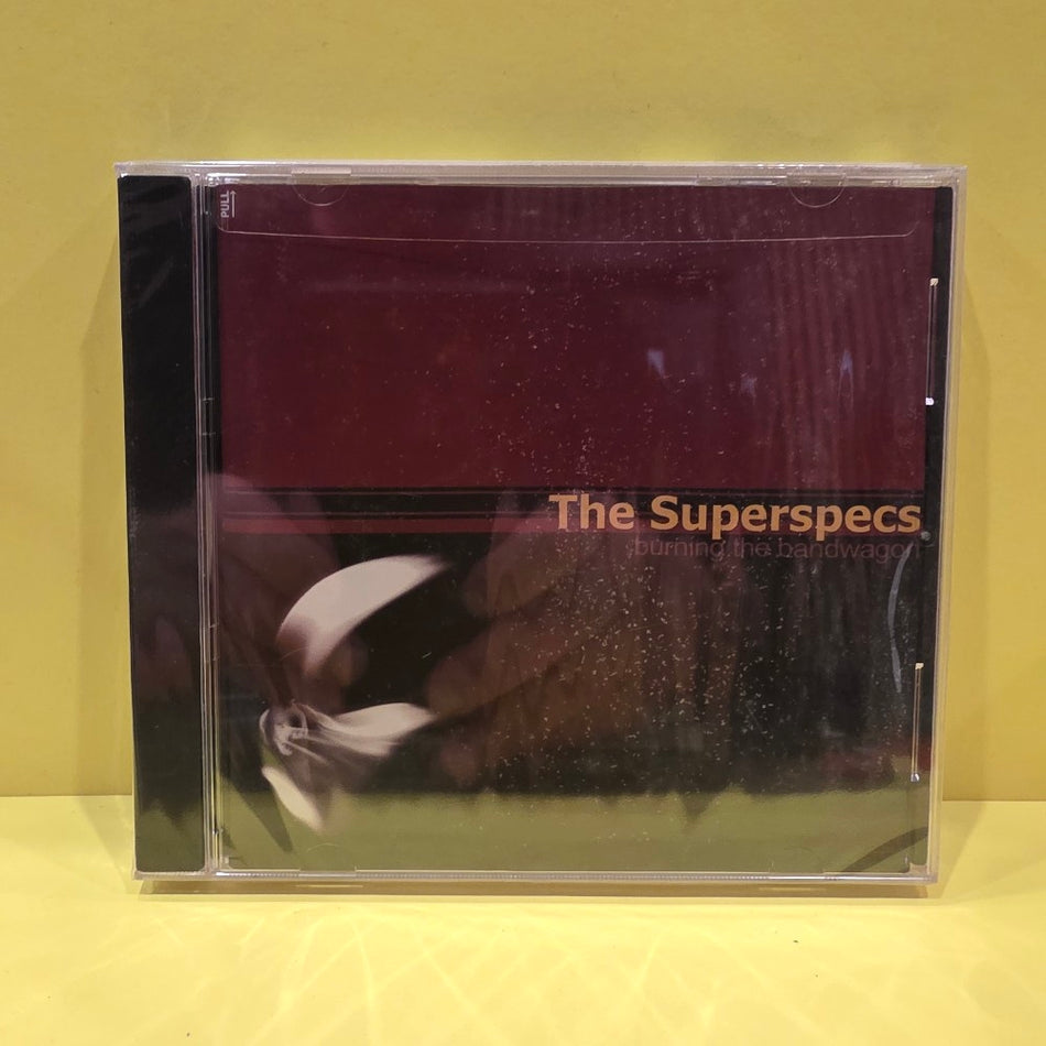 The Superspecs - Burning The Bandwagon - 2004 - 002 - New - Sealed - CDs