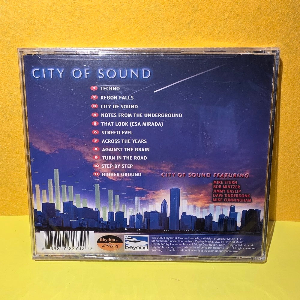 City Of Sound Featuring Mike Stern, Bob Mintzer, Jimmy Haslip, Dave Onderdonk, Mike Cunningham  - Beneath The Smooth Surface - 2002 - 398 578 273-2 - New - Sealed - CDs