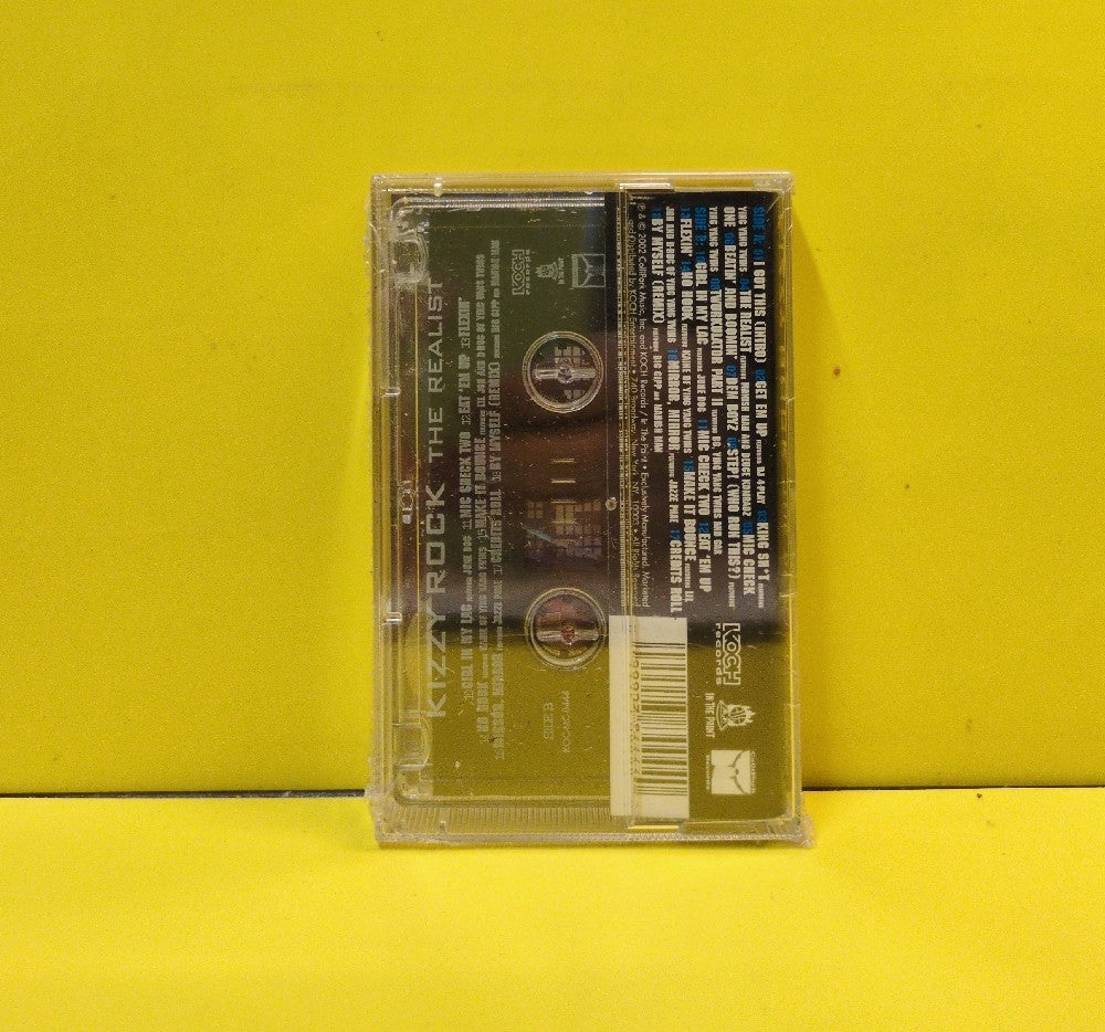 Kizzy Rock - The Realist - 2002 - KOC-MC-8444 - New - Sealed - Cassettes