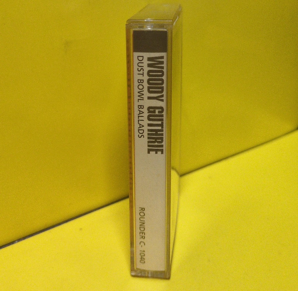 Woody Guthrie - Dust Bowl Ballads - 1991 - C-1040 - Used - EX - Cassettes - Reissue - Mono - Clear Tape Shell