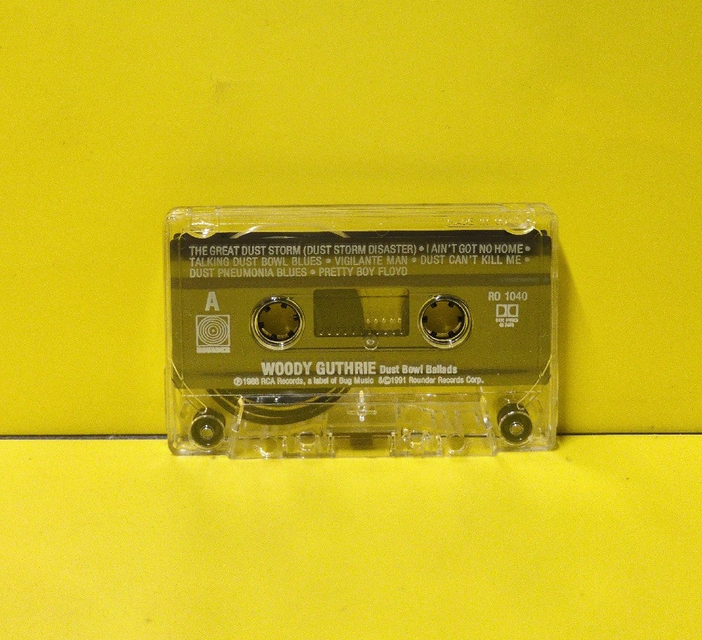 Woody Guthrie - Dust Bowl Ballads - 1991 - C-1040 - Used - EX - Cassettes - Reissue - Mono - Clear Tape Shell