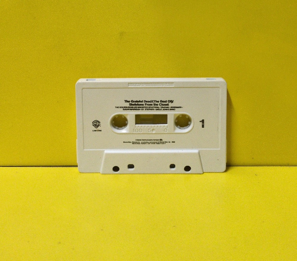 The Grateful Dead - (The Best Of) Skeletons From The Closet - L5W 2764 - Used - EX - Cassettes - Reissue - Small Font On White Tape Shell