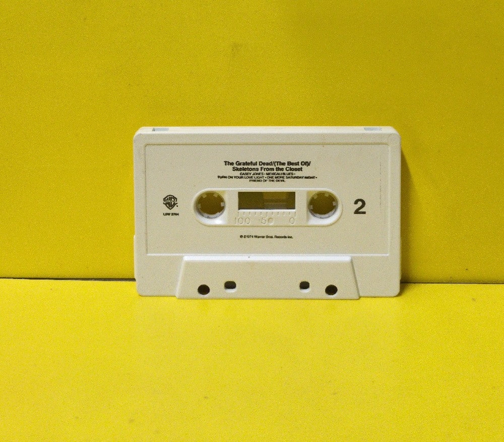 The Grateful Dead - (The Best Of) Skeletons From The Closet - L5W 2764 - Used - EX - Cassettes - Reissue - Small Font On White Tape Shell