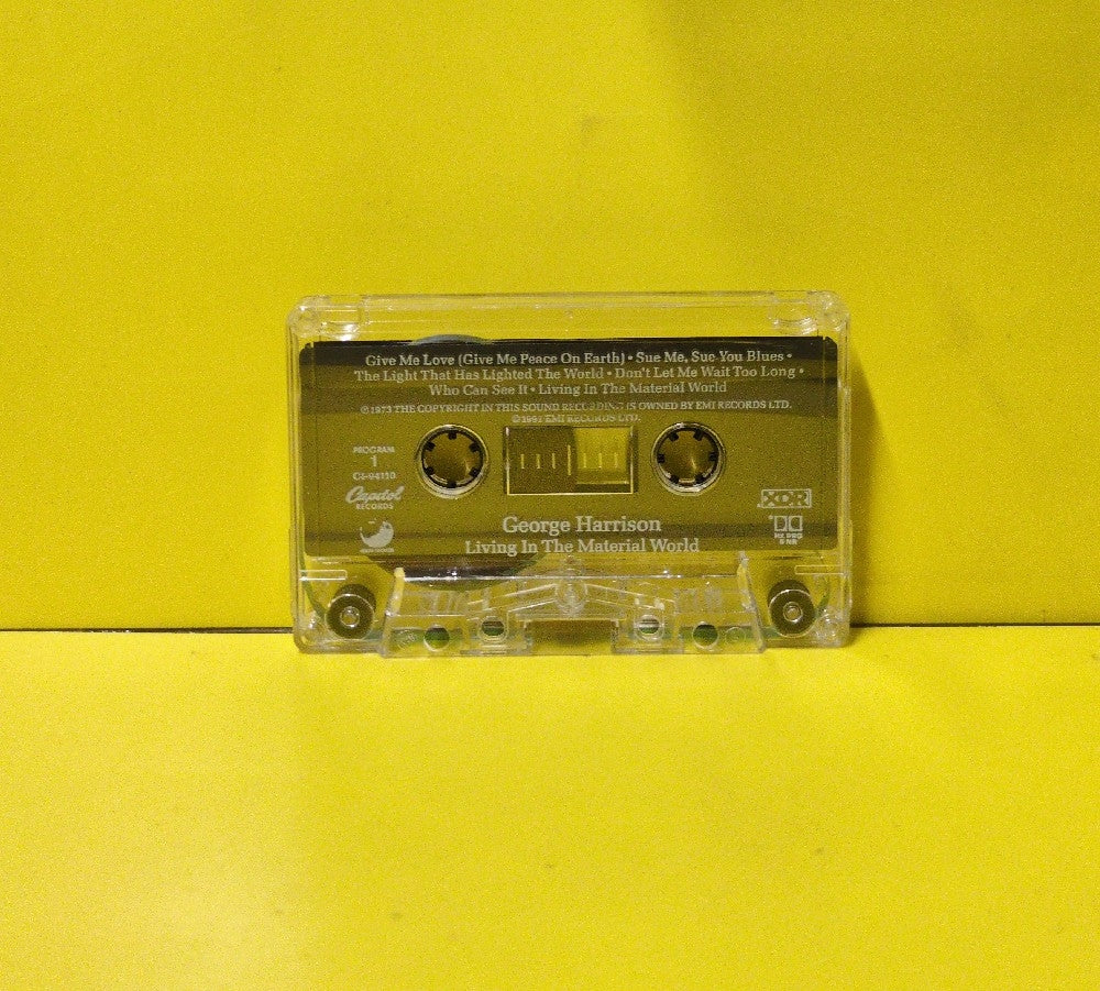 George Harrison - Living In The Material World - 1991 - C4-94110 - Used - EX - Cassettes - Reissue - Clear Tape Shell